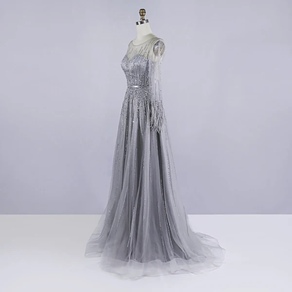 Haut de Gamme Gris Robe De Soirée 2020 Princesse Transparentes Encolure Dégagée Manches Longues Plumes Ceinture Perlage Paillettes Train De Balayage Volants Robe De Ceremonie