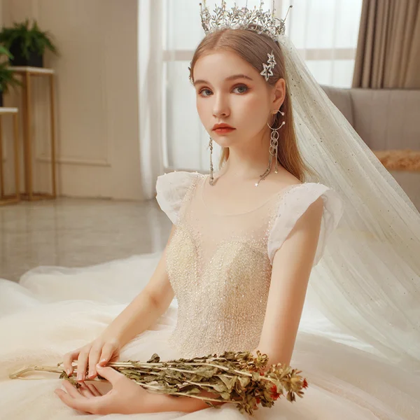 Meilleur La Mariée Champagne Transparentes Robe De Mariée 2020 Robe Boule Encolure Dégagée Sans Manches Dos Nu Perlage Glitter Tulle Cathedral Train Volants