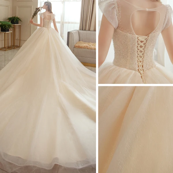 Meilleur La Mariée Champagne Transparentes Robe De Mariée 2020 Robe Boule Encolure Dégagée Sans Manches Dos Nu Perlage Glitter Tulle Cathedral Train Volants