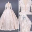 Illusion Champagne See-through Bridal Wedding Dresses 2020 Ball Gown Deep V-Neck Long Sleeve Backless Appliques Lace Beading Cathedral Train Ruffle