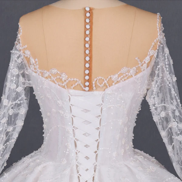 Luxe Ivoire Transparentes La Mariée Robe De Mariée 2020 Robe Boule Encolure Dégagée Manches Longues Fait main Perlage Glitter Tulle Cathedral Train