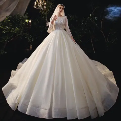 Romántico Champán Boda Vestidos De Novia 2020 Ball Gown Transparentes Scoop Escote Manga Larga Sin Espalda Rebordear Lentejuelas Glitter Tul Cathedral Train Ruffle
