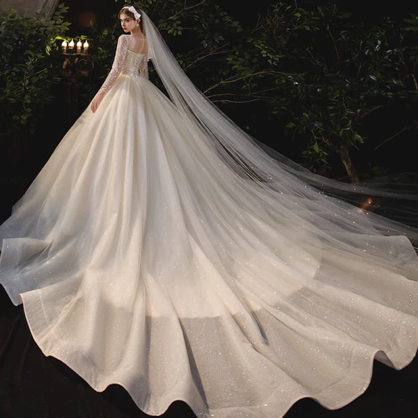Romantic Champagne Bridal Wedding Dresses 2020 Ball Gown See-through Scoop Neck Long Sleeve Backless Beading Sequins Glitter Tulle Cathedral Train Ruffle