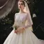 Romantic Champagne Bridal Wedding Dresses 2020 Ball Gown See-through Scoop Neck Long Sleeve Backless Beading Sequins Glitter Tulle Cathedral Train Ruffle