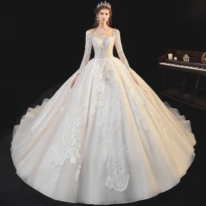 Beste Champagne Bryllups Brudekjoler 2020 Ballkjole Gjennomsiktig Scoop Halsen Langermede Ryggløse Appliques Blonder Beading Glitter Tyll Cathedral Train Buste