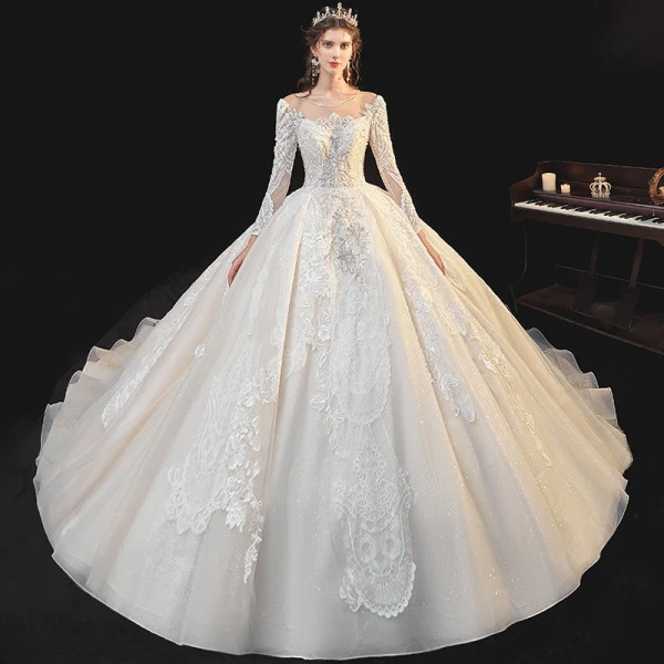 Meilleur Champagne La Mariée Robe De Mariée 2020 Robe Boule Transparentes Encolure Dégagée Manches Longues Dos Nu Appliques En Dentelle Perlage Glitter Tulle Cathedral Train Volants
