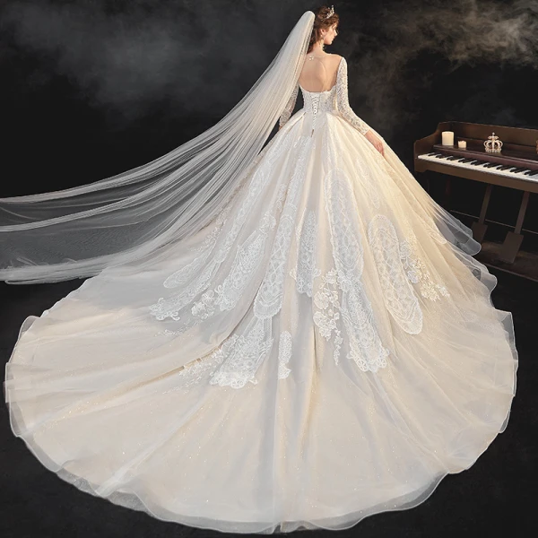 Meilleur Champagne La Mariée Robe De Mariée 2020 Robe Boule Transparentes Encolure Dégagée Manches Longues Dos Nu Appliques En Dentelle Perlage Glitter Tulle Cathedral Train Volants