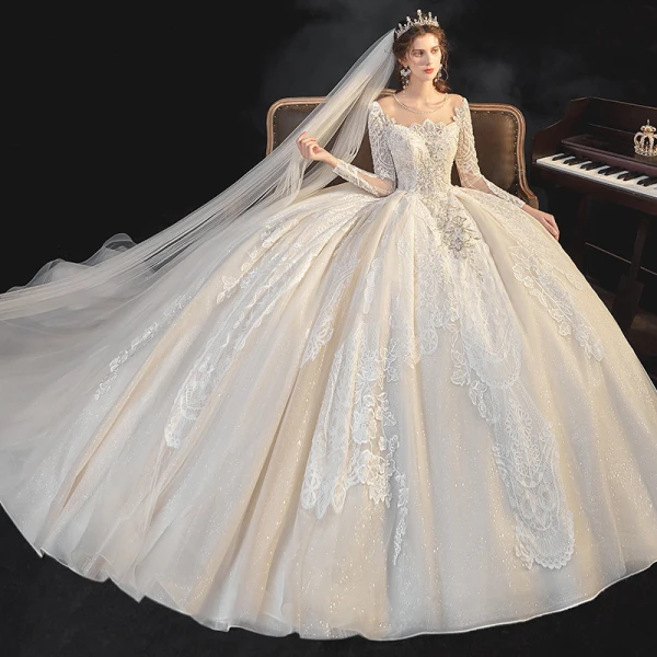 Meilleur Champagne La Mariée Robe De Mariée 2020 Robe Boule Transparentes Encolure Dégagée Manches Longues Dos Nu Appliques En Dentelle Perlage Glitter Tulle Cathedral Train Volants