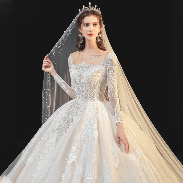 Meilleur Champagne La Mariée Robe De Mariée 2020 Robe Boule Transparentes Encolure Dégagée Manches Longues Dos Nu Appliques En Dentelle Perlage Glitter Tulle Cathedral Train Volants
