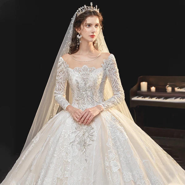 Meilleur Champagne La Mariée Robe De Mariée 2020 Robe Boule Transparentes Encolure Dégagée Manches Longues Dos Nu Appliques En Dentelle Perlage Glitter Tulle Cathedral Train Volants