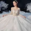 Illusion Champagne Transparentes La Mariée Robe De Mariée 2020 Robe Boule Encolure Dégagée 3/4 Manches Dos Nu Paillettes Perlage Glitter Tulle Cathedral Train Volants