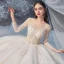 Illusion Champagne Transparentes La Mariée Robe De Mariée 2020 Robe Boule Encolure Dégagée 3/4 Manches Dos Nu Paillettes Perlage Glitter Tulle Cathedral Train Volants