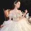 Schöne Champagner Organza Hochzeits Brautkleider / Hochzeitskleider 2020 Ballkleid Off Shoulder Kurze Ärmel Rückenfreies Perlenstickerei Strass Kathedrale Schleppe Rüschen