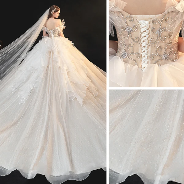 Schöne Champagner Organza Hochzeits Brautkleider / Hochzeitskleider 2020 Ballkleid Off Shoulder Kurze Ärmel Rückenfreies Perlenstickerei Strass Kathedrale Schleppe Rüschen