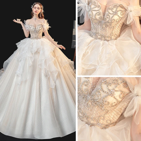 Schöne Champagner Organza Hochzeits Brautkleider / Hochzeitskleider 2020 Ballkleid Off Shoulder Kurze Ärmel Rückenfreies Perlenstickerei Strass Kathedrale Schleppe Rüschen