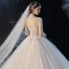 Romantique Champagne La Mariée Robe De Mariée 2020 Robe Boule Transparentes Col Haut 3/4 Manches Dos Nu Appliques En Dentelle Perlage Glitter Tulle Cathedral Train Volants