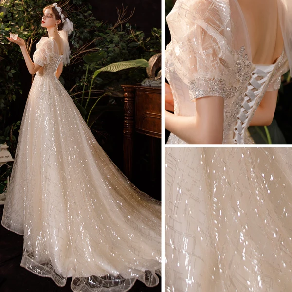 Style Victorien Champagne Jardin / Extérieur Robe De Mariée 2020 Princesse Transparentes Encolure Dégagée Gonflée Manches Courtes Dos Nu Perlage Paillettes Train De Balayage Volants