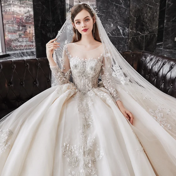 Luxury / Gorgeous Champagne See-through Bridal Wedding Dresses 2020 Ball Gown Scoop Neck Long Sleeve Backless Appliques Flower Beading Glitter Tulle Cathedral Train Ruffle