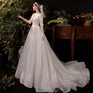 Champagne Outdoor Garden Light Wedding Dresses 2020 A Line Princess V Neck 1 2 Sleeves Backless Beading Sequins Glitter Tulle Sweep Train Ruffle