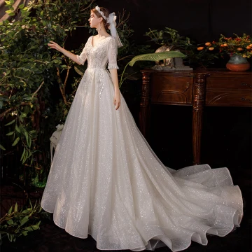 Champagne Outdoor Garden Light Wedding Dresses 2020 A Line Princess V Neck 1 2 Sleeves Backless Beading Sequins Glitter Tulle Sweep Train Ruffle