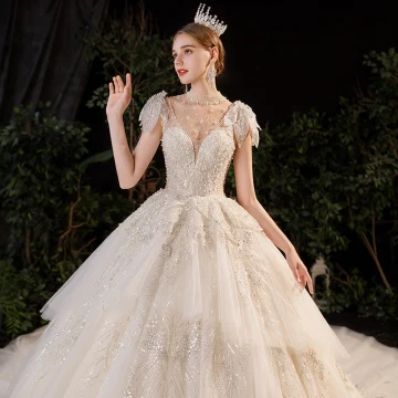 Luxury Gorgeous Champagne See Through Bridal Wedding Dresses 2020 Ball Gown High Neck Sleeveless Backless Handmade Sequins Beading Pearl Glitter Tulle Royal Train Ruffle