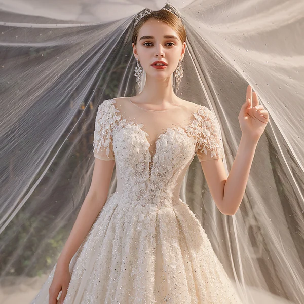 Luxury / Gorgeous Champagne Bridal Wedding Dresses 2020 Ball Gown See-through Scoop Neck Short Sleeve Backless Appliques Flower Beading Rhinestone Glitter Tulle Cathedral Train Ruffle