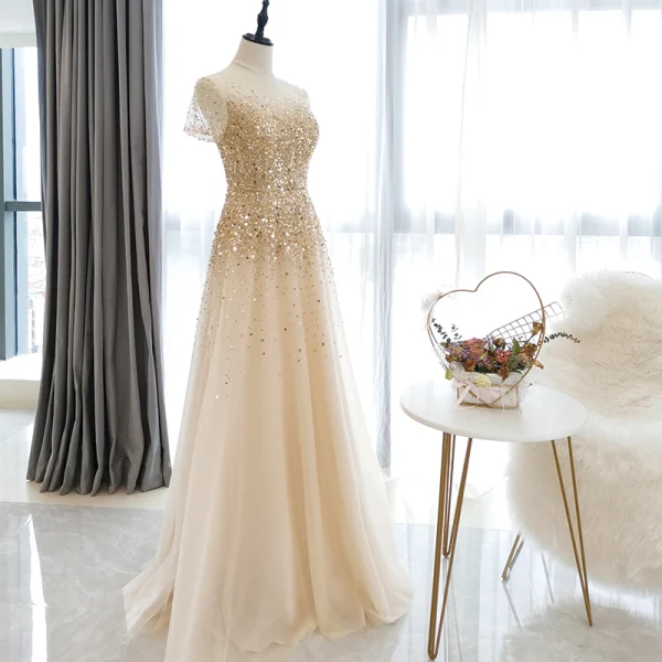 Haut de Gamme Champagne Transparentes Robe De Bal 2020 Princesse Encolure Dégagée Manches Courtes Perlage Paillettes Longue Volants Robe De Ceremonie