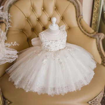 Best Ivory Birthday Flower Girl Dresses 2020 Ball Gown See Through Scoop Neck Sleeveless Appliques Flower Beading Bow Short Ruffle Wedding Party Dresses