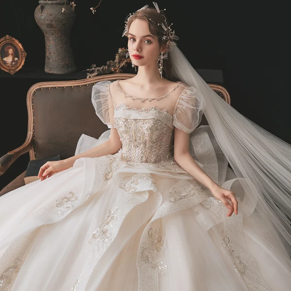 Luxe Champagne La Mariée Robe De Mariée 2020 Robe Boule Transparentes Encolure Dégagée Gonflée Manches Courtes Dos Nu Perlage Paillettes Glitter Tulle Royal Train Volants