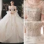 Luxe Champagne La Mariée Robe De Mariée 2020 Robe Boule Transparentes Encolure Dégagée Gonflée Manches Courtes Dos Nu Perlage Paillettes Glitter Tulle Royal Train Volants