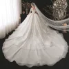 Luxury / Gorgeous Bridal Champagne Wedding Dresses 2020 Ball Gown See-through Scoop Neck Long Sleeve Backless Appliques Lace Beading Sequins Cathedral Train Ruffle