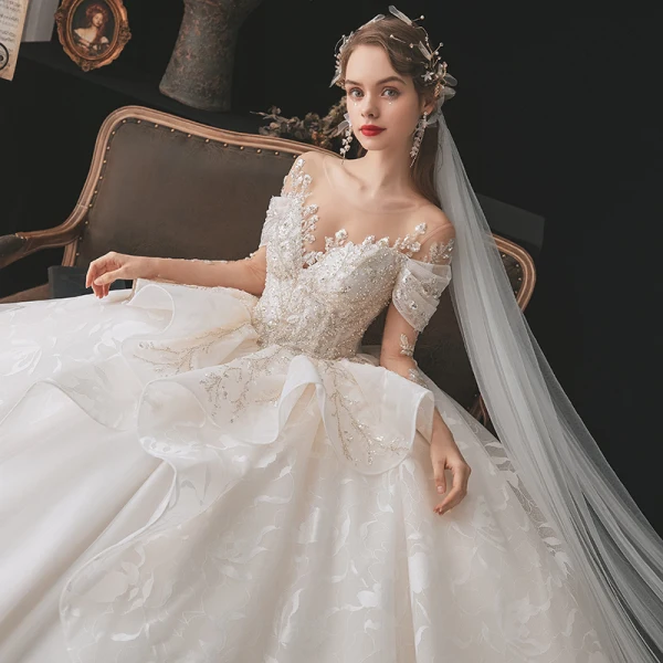 Luxury / Gorgeous Bridal Champagne Wedding Dresses 2020 Ball Gown See-through Scoop Neck Long Sleeve Backless Appliques Lace Beading Sequins Cathedral Train Ruffle
