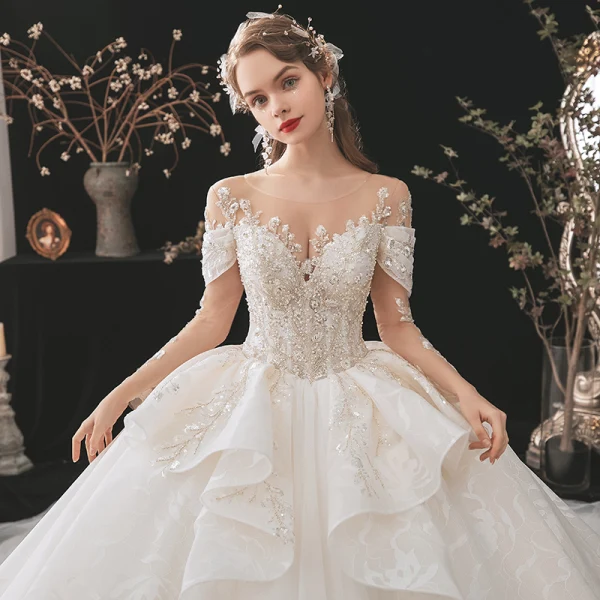 Luxury / Gorgeous Bridal Champagne Wedding Dresses 2020 Ball Gown See-through Scoop Neck Long Sleeve Backless Appliques Lace Beading Sequins Cathedral Train Ruffle
