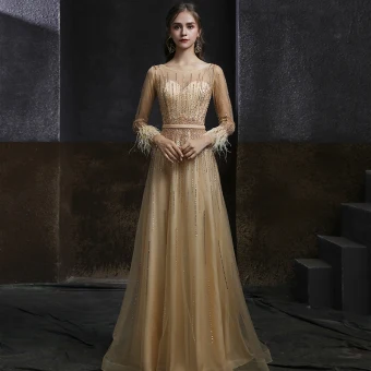 Best Champagne Gold Dancing Prom Dresses 2020 A Line Princess See Through Scoop Neck Long Sleeve Sash Beading Sequins Feather Floor Length Long Ruffle Formal Dresses