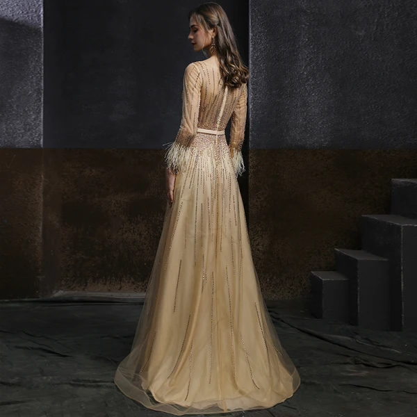 Meilleur Champagne Doré Dansant Robe De Bal 2020 Princesse Transparentes Encolure Dégagée Manches Longues Ceinture Perlage Paillettes Plumes Longue Volants Robe De Ceremonie