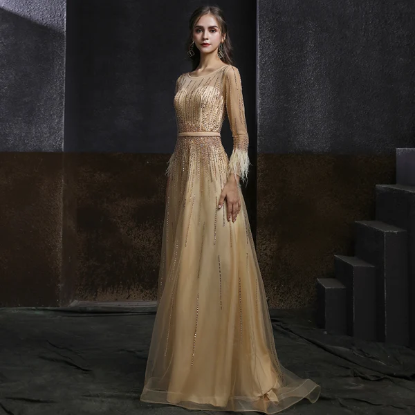 Meilleur Champagne Doré Dansant Robe De Bal 2020 Princesse Transparentes Encolure Dégagée Manches Longues Ceinture Perlage Paillettes Plumes Longue Volants Robe De Ceremonie