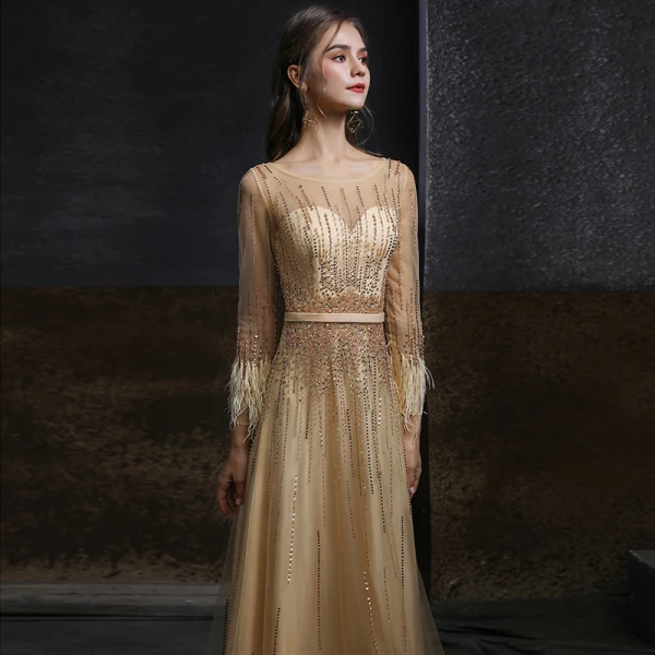Meilleur Champagne Doré Dansant Robe De Bal 2020 Princesse Transparentes Encolure Dégagée Manches Longues Ceinture Perlage Paillettes Plumes Longue Volants Robe De Ceremonie
