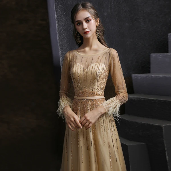 Meilleur Champagne Doré Dansant Robe De Bal 2020 Princesse Transparentes Encolure Dégagée Manches Longues Ceinture Perlage Paillettes Plumes Longue Volants Robe De Ceremonie