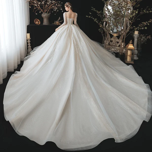 Vintage Champagner Durchsichtige Hochzeits Brautkleider / Hochzeitskleider 2020 Ballkleid Eckiger Ausschnitt Lange Ärmel Rückenfreies Perlenstickerei Pailletten Glanz Tülle Kathedrale Schleppe Rüschen