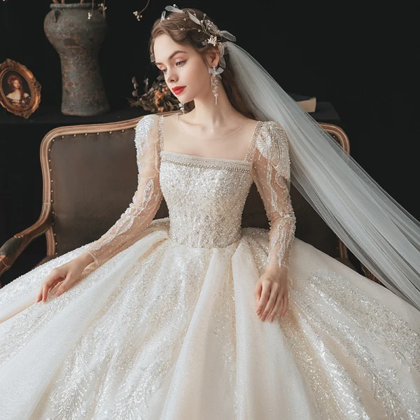 Vintage Champagner Durchsichtige Hochzeits Brautkleider / Hochzeitskleider 2020 Ballkleid Eckiger Ausschnitt Lange Ärmel Rückenfreies Perlenstickerei Pailletten Glanz Tülle Kathedrale Schleppe Rüschen