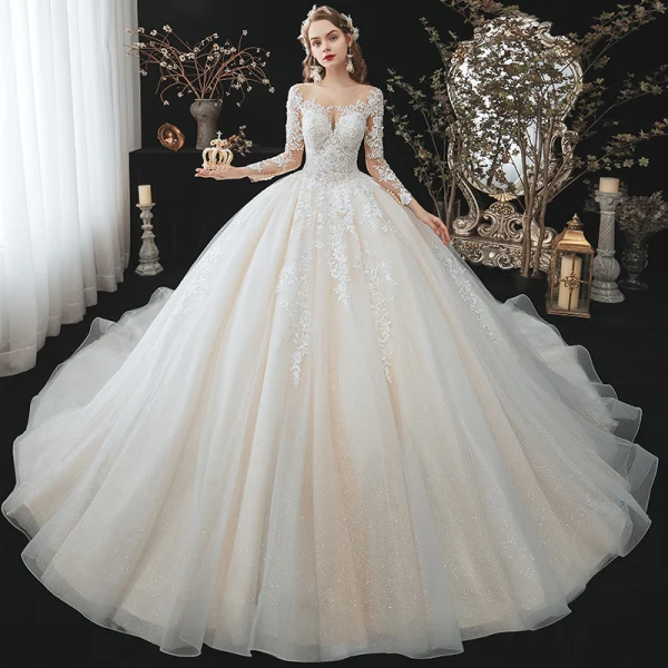 Charmant Champagne La Mariée Robe De Mariée 2020 Robe Boule Transparentes Encolure Dégagée 3/4 Manches Dos Nu Appliques En Dentelle Perlage Glitter Tulle Cathedral Train Volants