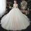 Charmant Champagne La Mariée Robe De Mariée 2020 Robe Boule Transparentes Encolure Dégagée 3/4 Manches Dos Nu Appliques En Dentelle Perlage Glitter Tulle Cathedral Train Volants