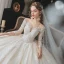 Charmant Champagne La Mariée Robe De Mariée 2020 Robe Boule Transparentes Encolure Dégagée 3/4 Manches Dos Nu Appliques En Dentelle Perlage Glitter Tulle Cathedral Train Volants