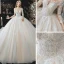 Charmant Champagne La Mariée Robe De Mariée 2020 Robe Boule Transparentes Encolure Dégagée 3/4 Manches Dos Nu Appliques En Dentelle Perlage Glitter Tulle Cathedral Train Volants
