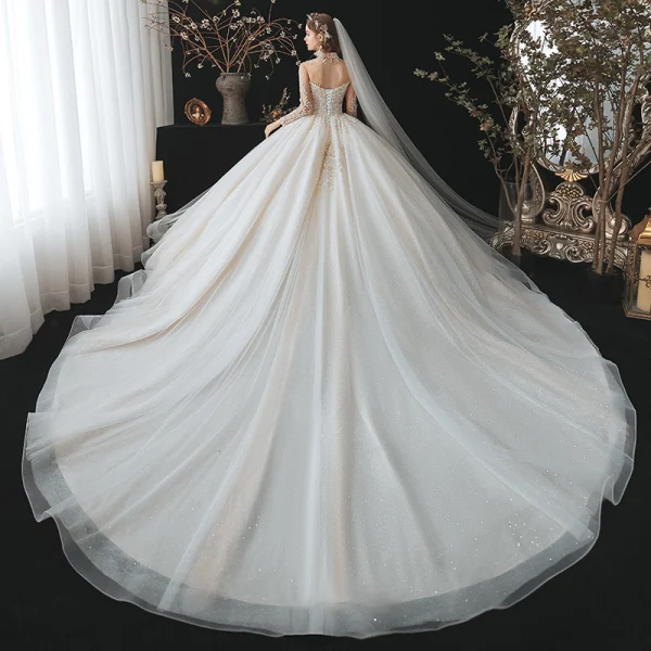 Romantique Champagne La Mariée Robe De Mariée 2020 Robe Boule Transparentes Col Haut Manches Longues Dos Nu Perlage Glitter Tulle Cathedral Train Volants
