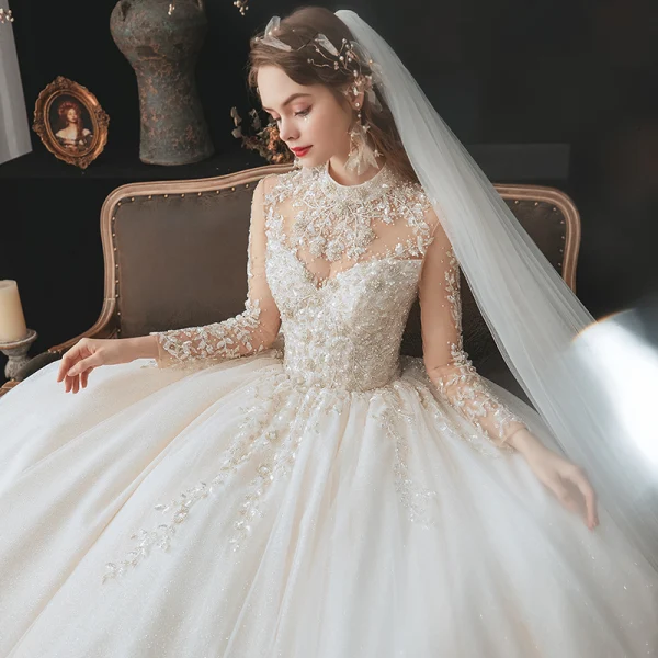 Romantique Champagne La Mariée Robe De Mariée 2020 Robe Boule Transparentes Col Haut Manches Longues Dos Nu Perlage Glitter Tulle Cathedral Train Volants