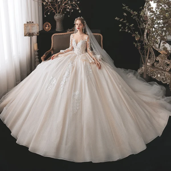 Charming Champagne Bridal Wedding Dresses 2020 Ball Gown See-through Scoop Neck Long Sleeve Backless Appliques Lace Beading Glitter Tulle Cathedral Train Ruffle