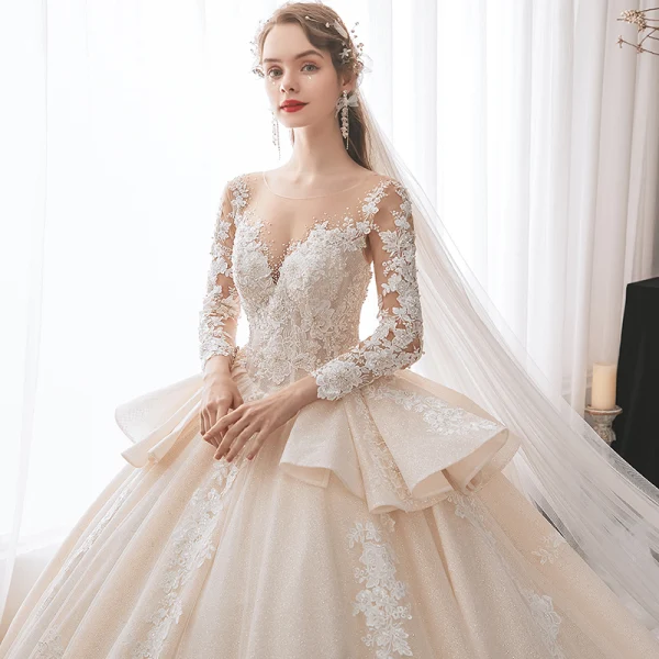 Charming Champagne Bridal Wedding Dresses 2020 Ball Gown See-through Scoop Neck Long Sleeve Backless Appliques Lace Beading Glitter Tulle Cathedral Train Ruffle