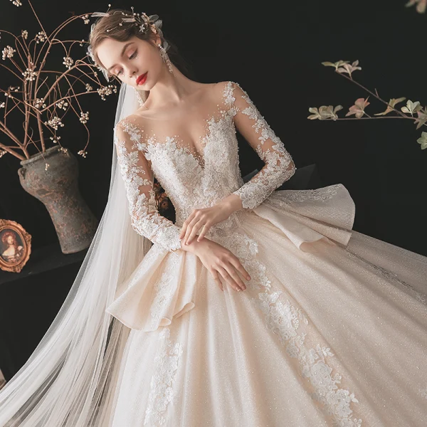 Charming Champagne Bridal Wedding Dresses 2020 Ball Gown See-through Scoop Neck Long Sleeve Backless Appliques Lace Beading Glitter Tulle Cathedral Train Ruffle