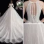 Abordable Ivoire La Mariée Robe De Mariée 2020 Robe Boule Encolure Dégagée Sans Manches Dos Nu Perlage Paillettes Cathedral Train Volants